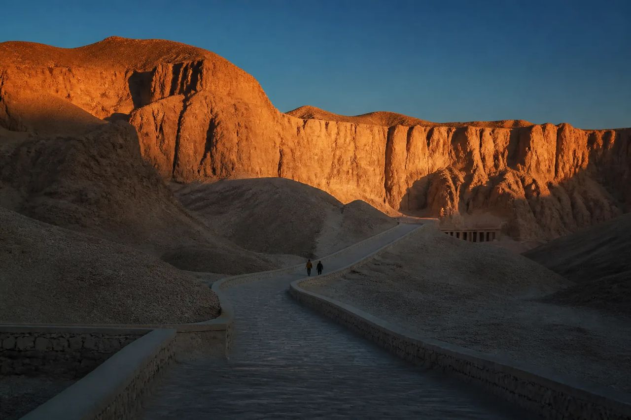 The Valley of the Kings at sunrise, winding path between limestone cliffs
