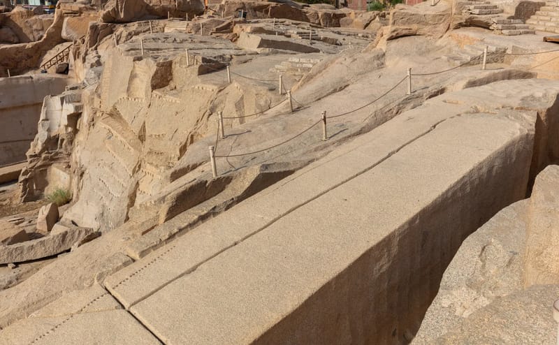 The unfinished obelisk lying cracked in its granite quarry at Aswan