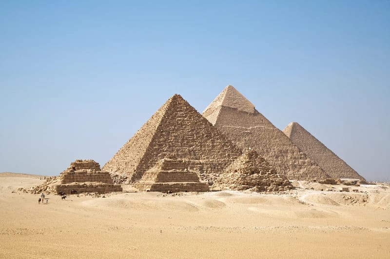 The pyramids of Khafre and Menkaure on the Giza plateau with a small queen pyramid in front