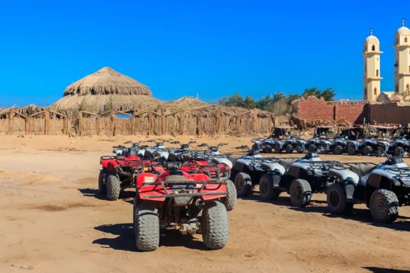 Quad bikes parked at a desert safari stop near Hurghada
