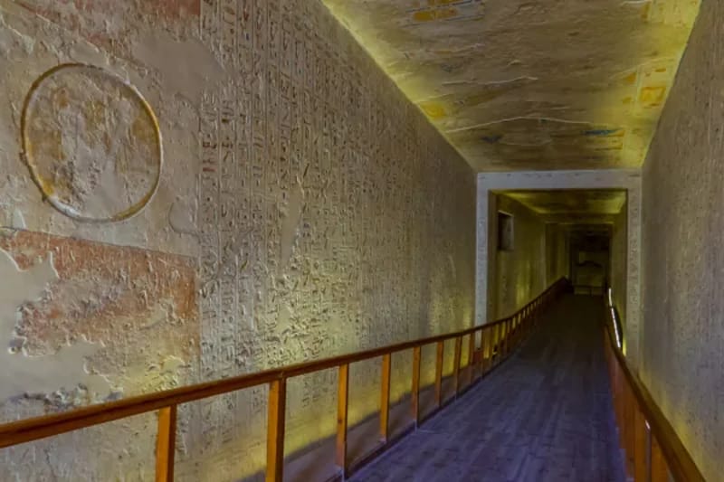 Lit corridor with painted walls inside a royal tomb in the Valley of the Kings